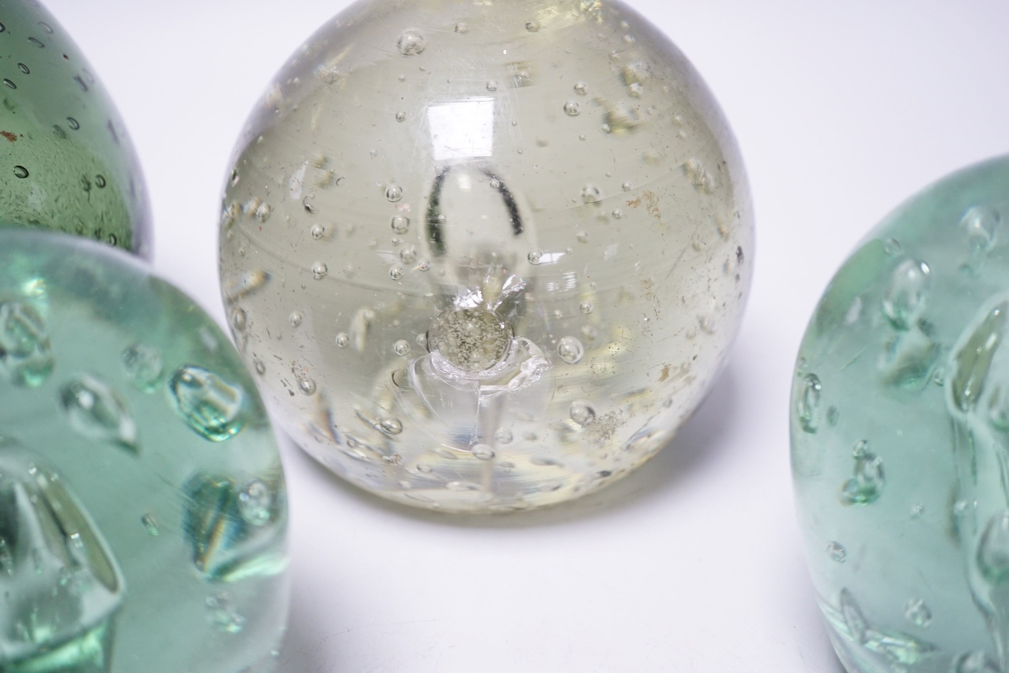 Four Victorian green glass dumps, tallest 16cm